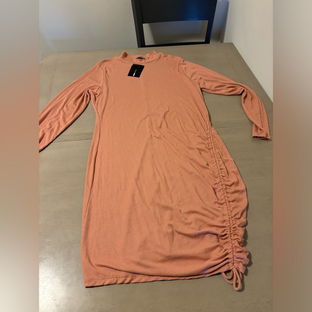 Brand new with tags fashion nova bodycon dress peach color with side tie